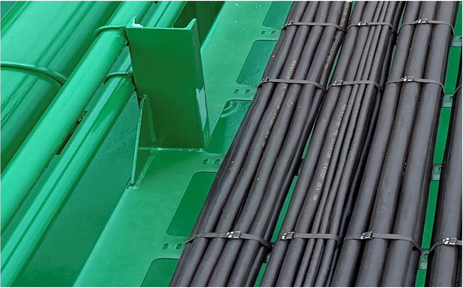 Diet Tray on a ship deck with cable bundles strapped to its slotted rails